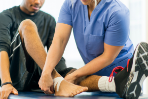 Physical Therapist helping a patient