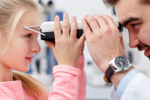Untitled (11 x 8.5 in) (1056 × 816 px) (52) An optical assistant measuring a child's eyesight